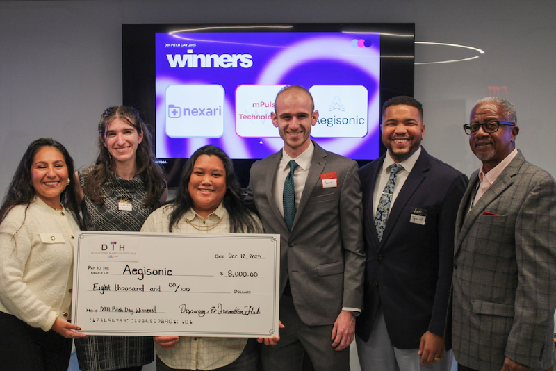 Aegisonic founders and Mount Sinai DIH leadership posing with large ceremonial check.