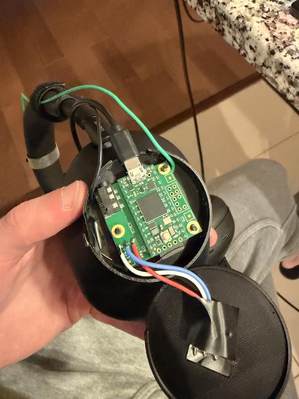 Exposed circuit board within earpiece of over-ear headphones.
